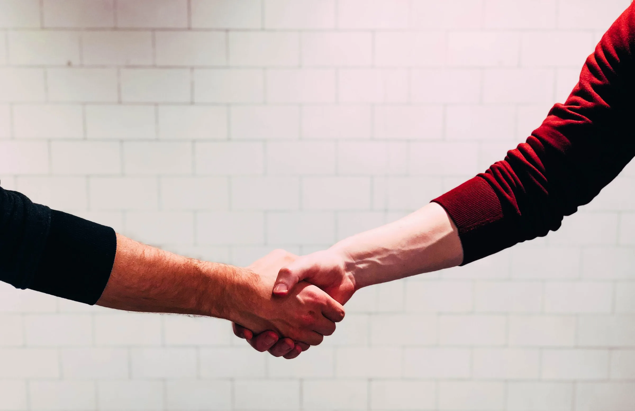 Shaking hands in a business deal Shaking hands in a business deal